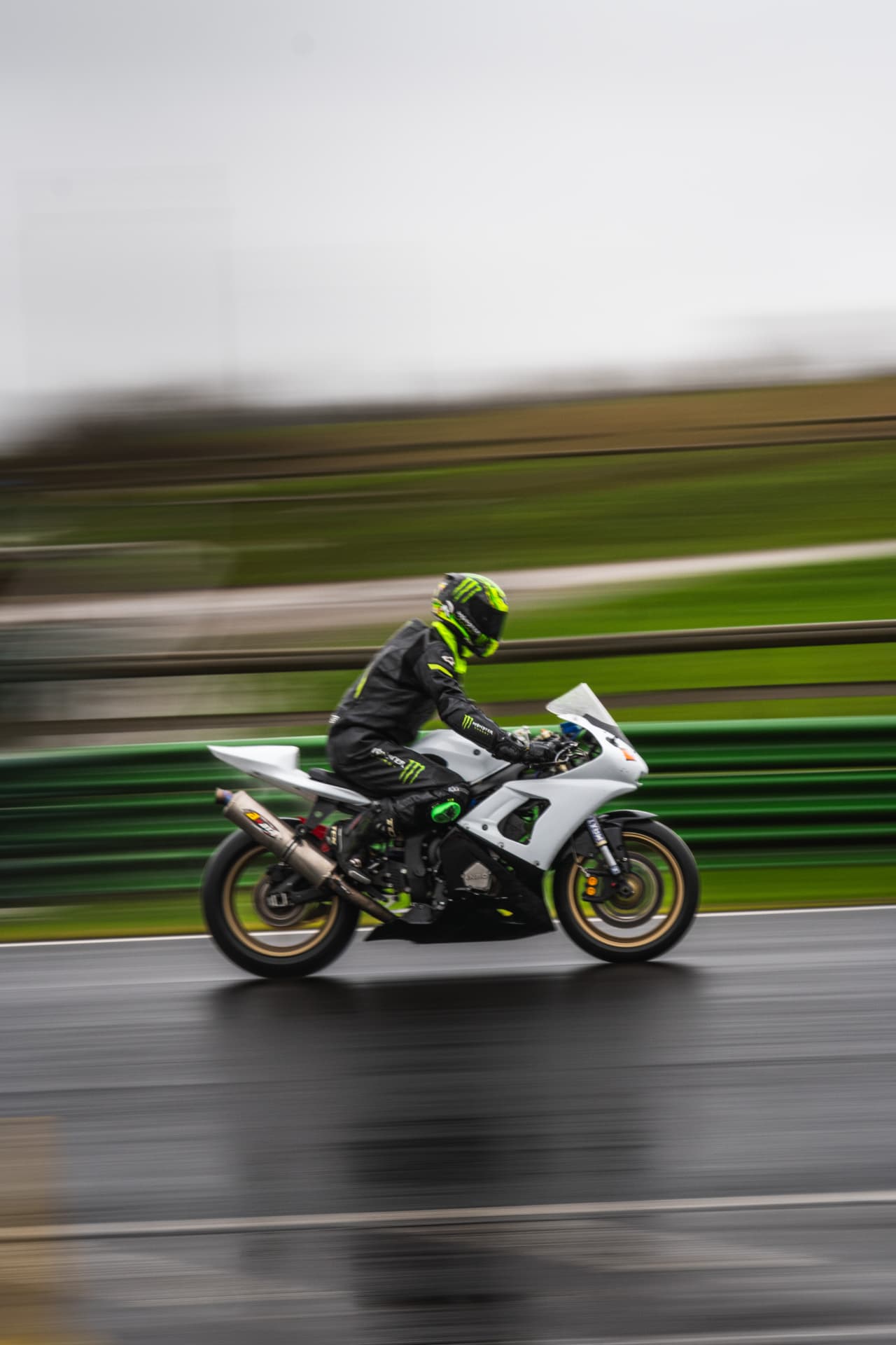 White Machine: Panning Shot on a Wet Track — example photograph.