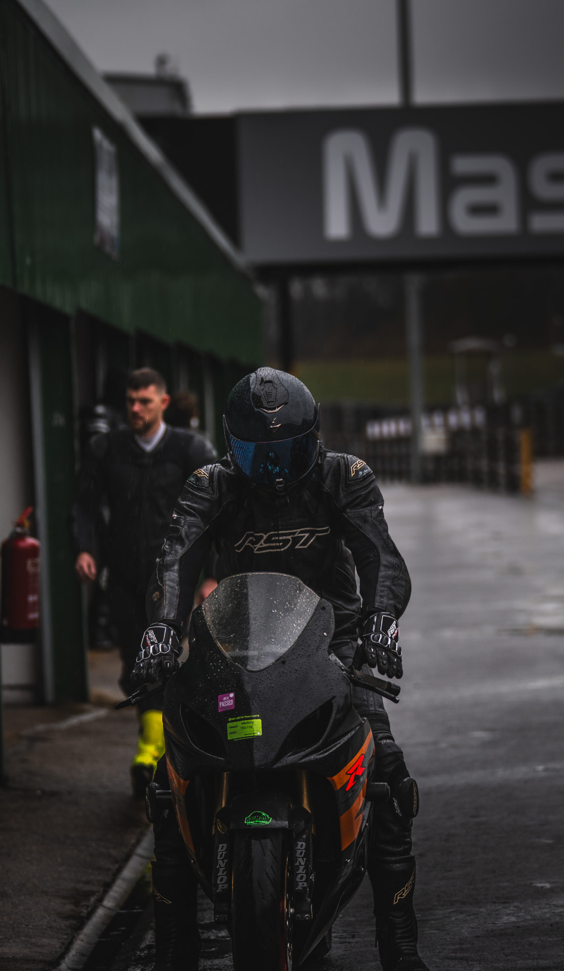 Waiting for the Green: Rider at Rest in the Pit Lane — example photograph.