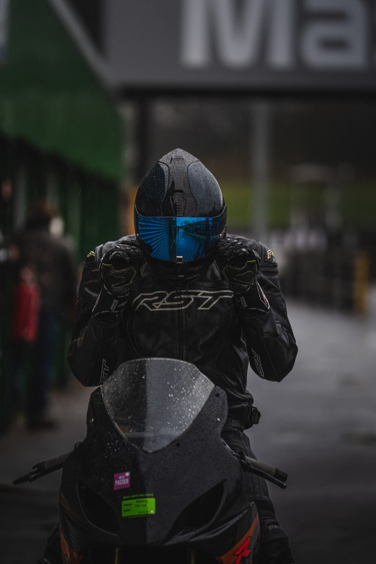 Wet Season: Rider and Machine in the Rain — example photograph.