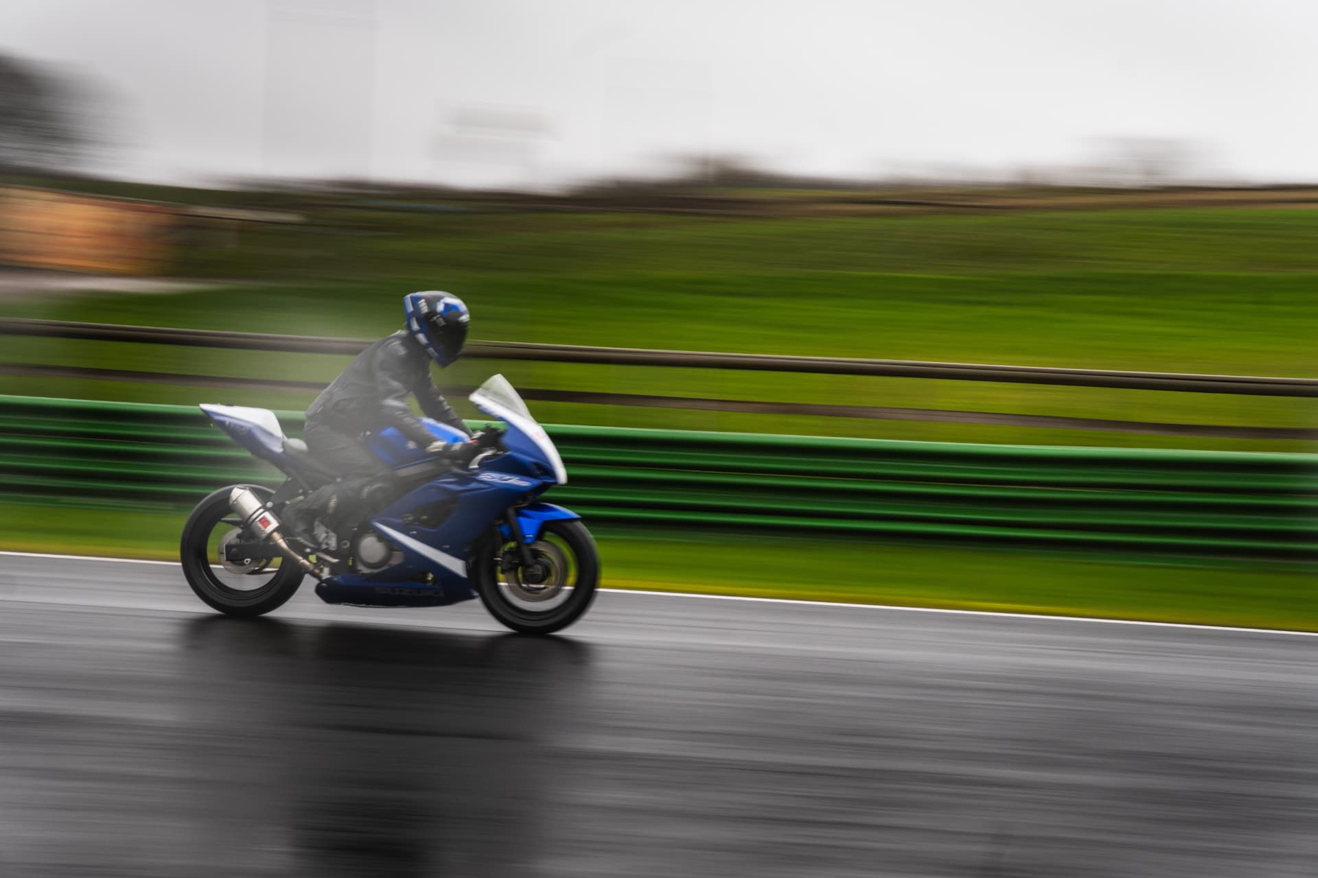Blue Blur: Speed Along a Wet Circuit — example photograph.
