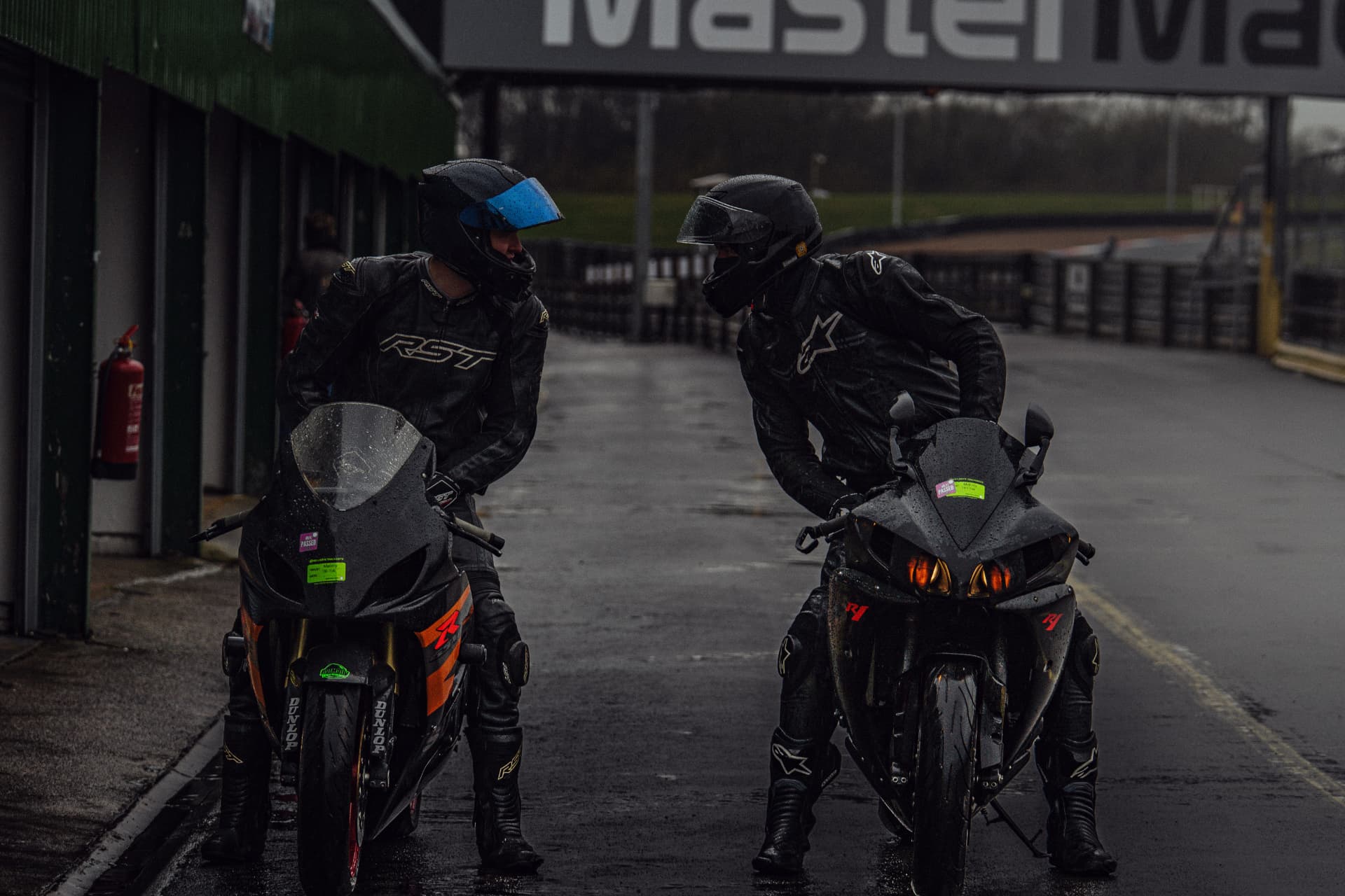 Two Riders, One Thought: Waiting in the Pit Lane — example photograph.